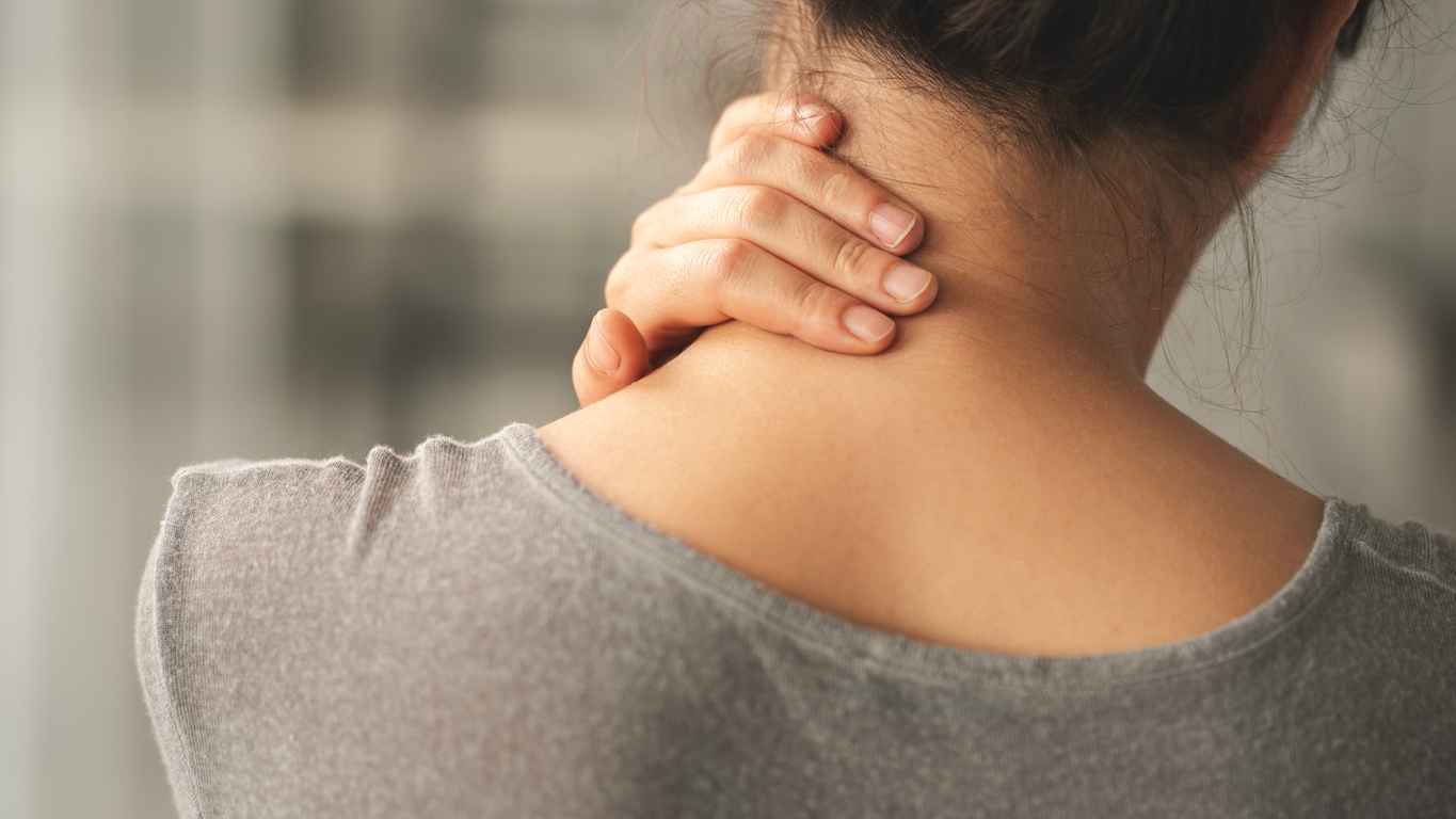 Woman suffering from nack pain